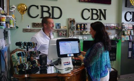 Hans, the owner, talking with a customer at the counter