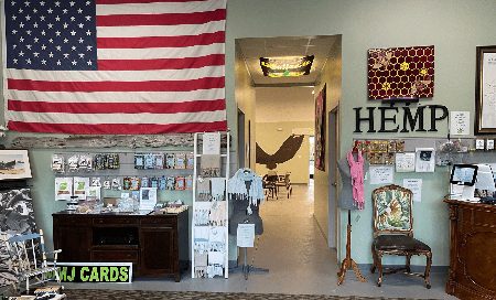 The front room: card racks, seating and the hallway through to the studio